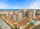 Stunning aerial view of condo community with manicured landscaping, pools and bay views at 501 Mandalay Ave # 810, Clearwater Beach, FL 33767