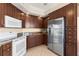 Updated kitchen with granite countertops, stainless steel appliances, and ample cabinet space at 501 Mandalay Ave # 810, Clearwater Beach, FL 33767