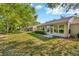 Expansive backyard views with shade trees and verdant grass at 5245 Lochmead Ter, Zephyrhills, FL 33541