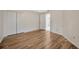 Bedroom features wood floors, a ceiling fan, and closet at 5245 Lochmead Ter, Zephyrhills, FL 33541