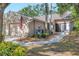 Charming home featuring a two-car garage, manicured landscaping, and an inviting entrance at 5245 Lochmead Ter, Zephyrhills, FL 33541