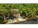 Charming single-Gathering home with a two-car garage and mature trees in a quiet neighborhood at 5245 Lochmead Ter, Zephyrhills, FL 33541