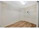 Walk-in closet with wire shelving and laminate floors at 5245 Lochmead Ter, Zephyrhills, FL 33541