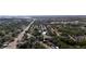 This aerial view shows the property's location within a neighborhood near a main street and a lake at 5444 70Th N Ln, St Petersburg, FL 33709