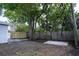 Backyard with fencing and concrete slabs for easy landscaping at 5444 70Th N Ln, St Petersburg, FL 33709
