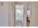 Hallway view of the bathroom with a trendy tile floor and a full tub/shower combo, providing a sleek design at 5444 70Th N Ln, St Petersburg, FL 33709