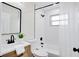 Modern bathroom featuring a stylish vanity, contemporary fixtures, and a well-lit shower area at 5444 70Th N Ln, St Petersburg, FL 33709