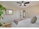 Bright bedroom featuring ample closet space, a ceiling fan, and neutral decor that offers a relaxing atmosphere at 5444 70Th N Ln, St Petersburg, FL 33709
