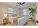 Cozy bedroom with a ceiling fan, natural light, and ample space; designed for comfort and relaxation at 5444 70Th N Ln, St Petersburg, FL 33709