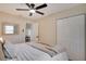 Bright and airy bedroom with a ceiling fan, closet, and natural light, offering a calm and relaxing space at 5444 70Th N Ln, St Petersburg, FL 33709