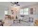 Comfortable living room showcases natural light, stylish furnishings, and seamless transition to adjacent bedroom at 5444 70Th N Ln, St Petersburg, FL 33709