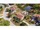 Aerial view of home with a screened pool and well-manicured backyard at 7345 Brightwaters Ct, New Port Richey, FL 34652