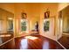 Unique bedroom with mirrors and wood floors, providing ample light and reflection at 7345 Brightwaters Ct, New Port Richey, FL 34652