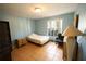 Bedroom features tile floors, a ceiling light, a window, and neutral paint at 7345 Brightwaters Ct, New Port Richey, FL 34652