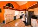 Bright kitchen with tiled countertops and floors, stainless steel appliances, and abundant storage space at 7345 Brightwaters Ct, New Port Richey, FL 34652