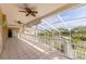 Spacious screened lanai with tile floors and a view of the lake at 7345 Brightwaters Ct, New Port Richey, FL 34652
