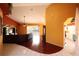 Spacious living room with cathedral ceiling, hardwood floors, and natural light at 7345 Brightwaters Ct, New Port Richey, FL 34652