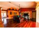 Bright living room with hardwood floors, stylish decor, and large windows offering plenty of natural light at 7345 Brightwaters Ct, New Port Richey, FL 34652