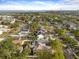 Aerial view of neighborhood featuring lush green trees plus water view in the distance at 7417 S Morton St, Tampa, FL 33616