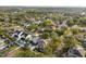 A neighborhood is pictured from above, showcasing tree coverage and rooftops at 7417 S Morton St, Tampa, FL 33616