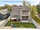 Spacious backyard featuring artificial turf, a playground, patio seating, and a mini putting green at 7417 S Morton St, Tampa, FL 33616