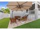 Charming backyard patio area with lovely outdoor seating, ideal for entertaining and relaxation at 7417 S Morton St, Tampa, FL 33616