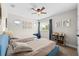 Cozy bedroom with two beds, ceiling fan, natural light, and decor for a relaxed, welcoming atmosphere at 7417 S Morton St, Tampa, FL 33616