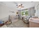 Comfortable Bedroom with decor, crib, and chair, creating a cozy and functional space for a  at 7417 S Morton St, Tampa, FL 33616