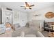 Bedroom featuring a crib, decor, and a comfortable chair, creating a calm and inviting space at 7417 S Morton St, Tampa, FL 33616