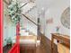 Welcoming foyer with hardwood floors, staircase, and decorative accents at 7417 S Morton St, Tampa, FL 33616