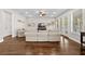 Spacious living room with hardwood floors, neutral furniture, and backyard access at 7417 S Morton St, Tampa, FL 33616