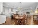 Open-concept living space with a dining area, kitchen, and modern chandelier at 7417 S Morton St, Tampa, FL 33616