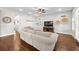 Bright living room with hardwood floors, ample seating, and natural light at 7417 S Morton St, Tampa, FL 33616