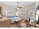 Bright main bedroom with natural light, wood floors, and a ceiling fan at 7417 S Morton St, Tampa, FL 33616