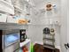 Walk-in pantry with wire shelving and ample storage for kitchen appliances and groceries at 7417 S Morton St, Tampa, FL 33616