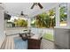 Relaxing covered patio with comfortable lounge seating and a ceiling fan at 7417 S Morton St, Tampa, FL 33616