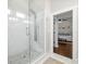 Glass enclosed shower featuring subway tile surround, rainfall showerhead, and integrated body jets at 7417 S Morton St, Tampa, FL 33616