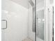 Glass enclosed shower featuring subway tile surround, rainfall showerhead, and integrated body jets at 7417 S Morton St, Tampa, FL 33616