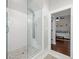 Glass enclosed shower featuring subway tile surround, rainfall showerhead, and integrated body jets at 7417 S Morton St, Tampa, FL 33616