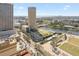Day aerial view highlighting a waterfront and lush park, with modern buildings offering luxury urban living and stunning scenery at 777 N Ashley Dr # 2610, Tampa, FL 33602