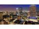 Night aerial view highlighting a lit cityscape, showcasing urban density with modern buildings and city lights at twilight at 777 N Ashley Dr # 2610, Tampa, FL 33602