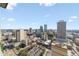Day aerial view showcasing the city skyline, featuring modern buildings and the vibrant urban landscape with ample parking at 777 N Ashley Dr # 2610, Tampa, FL 33602