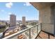 Balcony overlooking an expansive city view, with glass railings and wood-look flooring, offering a luxurious outdoor space at 777 N Ashley Dr # 2610, Tampa, FL 33602