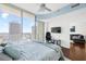 Bedroom with floor-to-ceiling windows offering an expansive skyline view; stylish furnishings with a TV and lounge area at 777 N Ashley Dr # 2610, Tampa, FL 33602