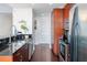 Modern kitchen featuring stainless steel appliances, dark countertops, and a tiled backsplash at 777 N Ashley Dr # 2610, Tampa, FL 33602