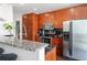 Kitchen with stainless steel appliances, dark cabinets, granite countertops and ample storage at 777 N Ashley Dr # 2610, Tampa, FL 33602