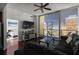 Living room with a plush sofa, dark wood floors, city views and an open balcony at 777 N Ashley Dr # 2610, Tampa, FL 33602
