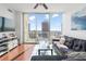 Bright living room featuring floor-to-ceiling windows and sliding glass door to the balcony at 777 N Ashley Dr # 2610, Tampa, FL 33602