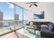 Relax in this comfortable living room with amazing city views and sliding door access to the balcony at 777 N Ashley Dr # 2610, Tampa, FL 33602