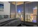 Bedroom featuring a comfortable queen-sized bed, city views and large glass windows at 777 N Ashley Dr # 2610, Tampa, FL 33602